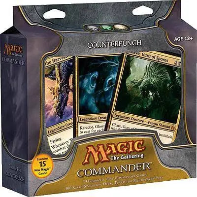 Card game packaging for 'Magic: The Gathering Commander' with card images and branding.